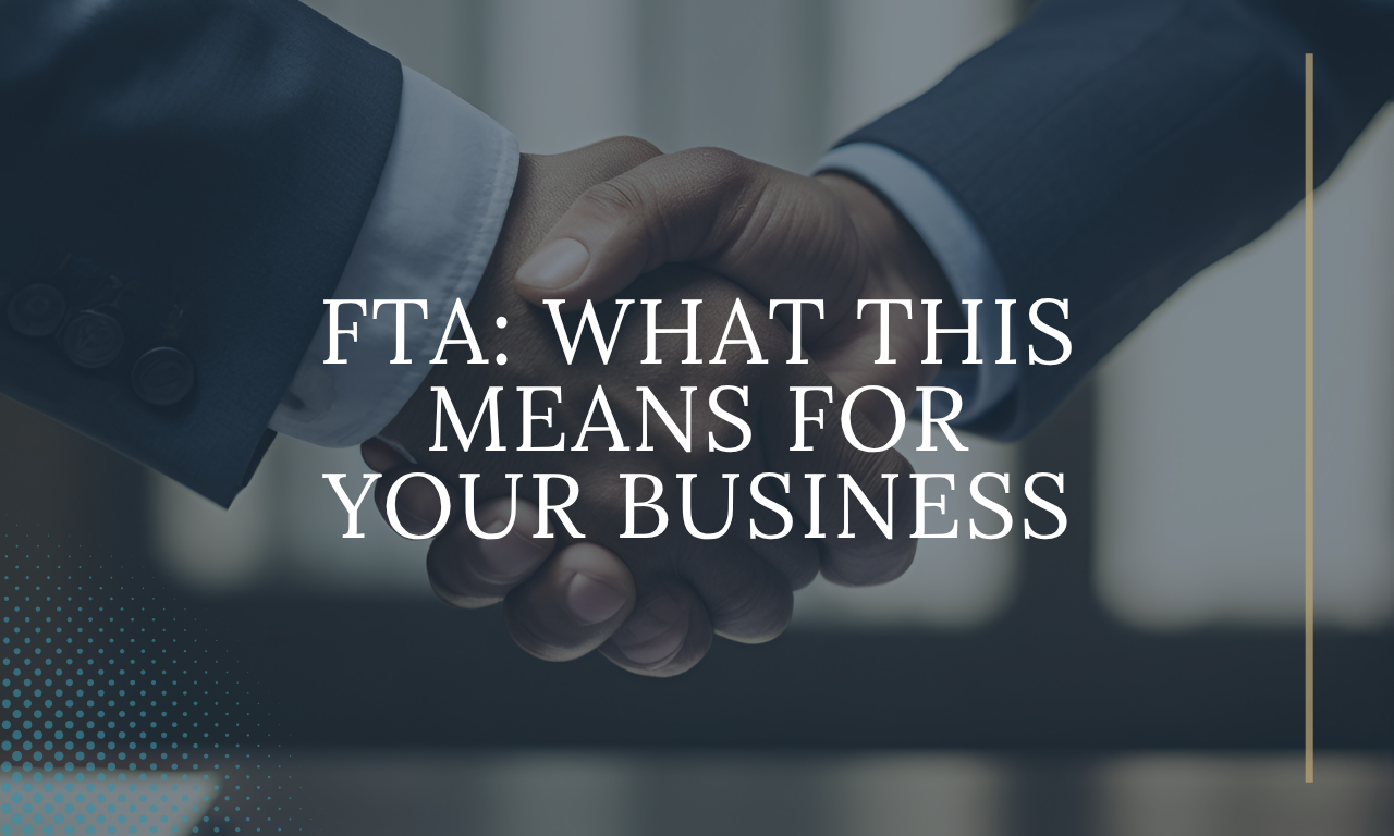 Close-up of two business professionals in suits shaking hands, symbolising partnership and agreement, with overlaid text reading &ldquo;FTA: What This Means for Your Business&rdquo; on a dark blue-toned background with a subtle dotted design and vertical gold accent line.